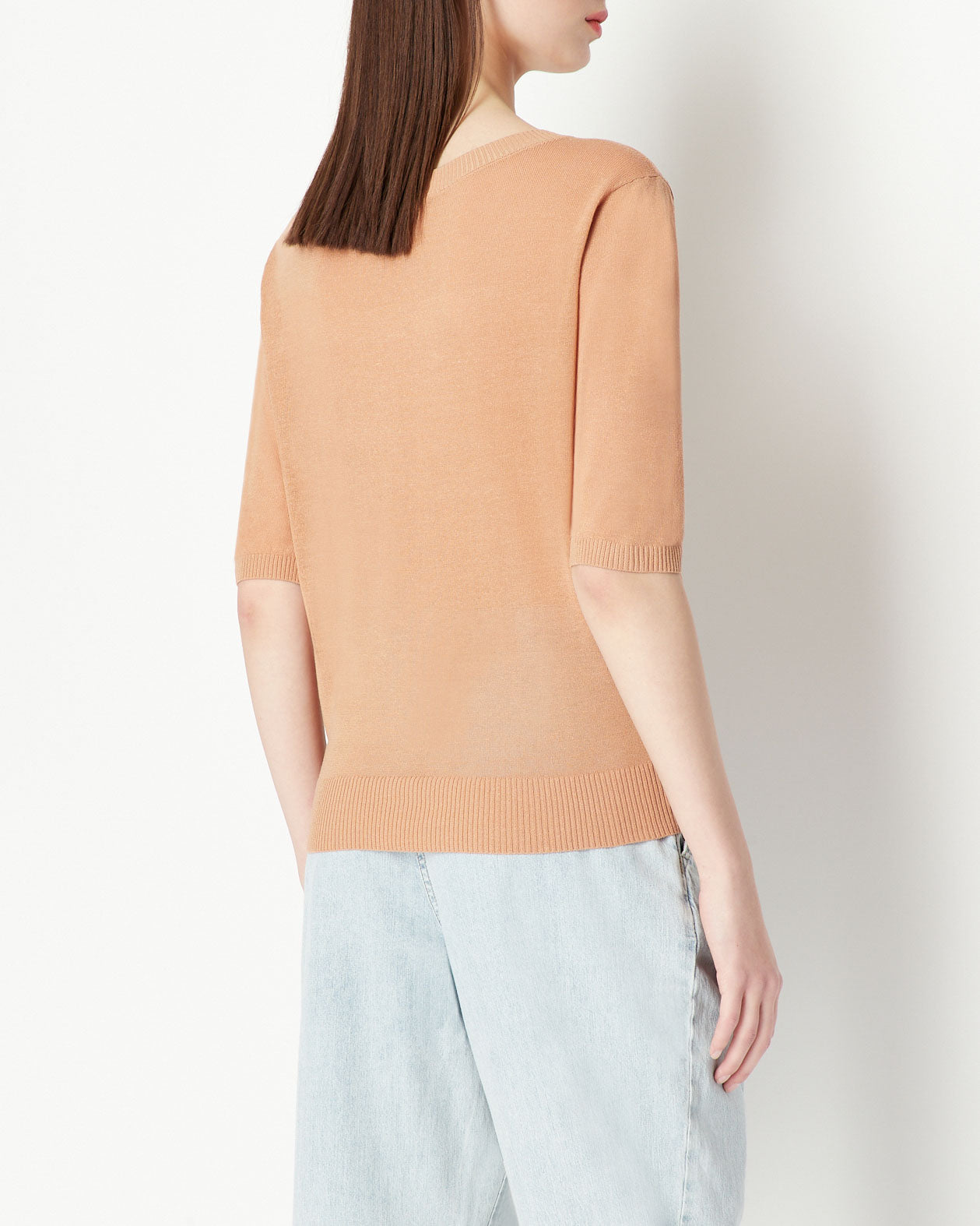 Woman knitted pullover, brush